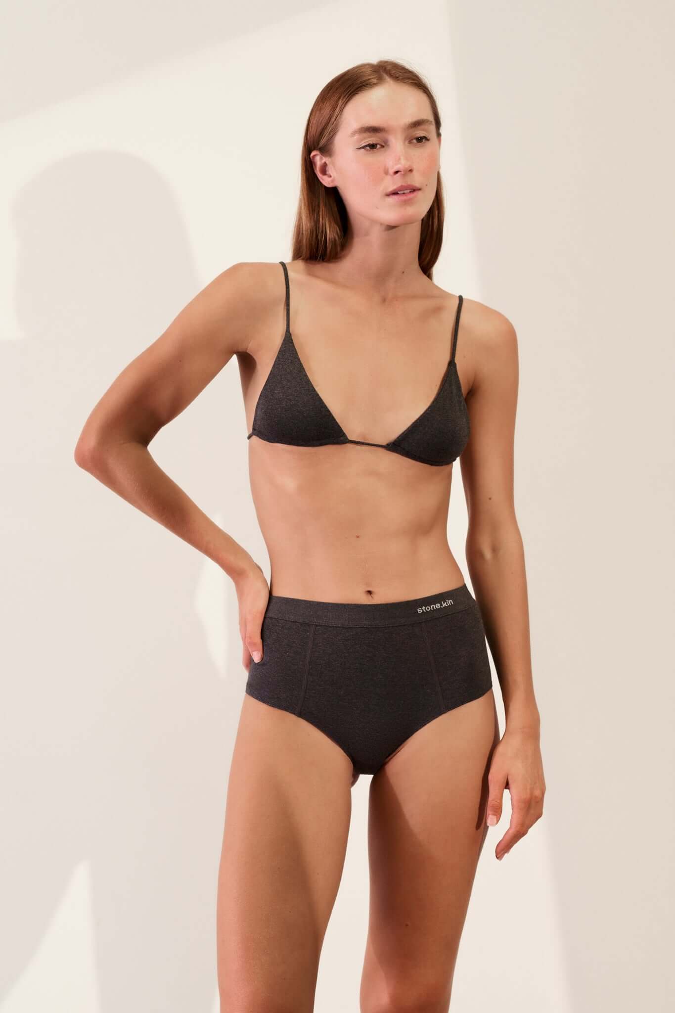 Triangle Bralette in Organic Cotton Rib - Tar worn by a model, showcasing the natural softness and flexible fit.