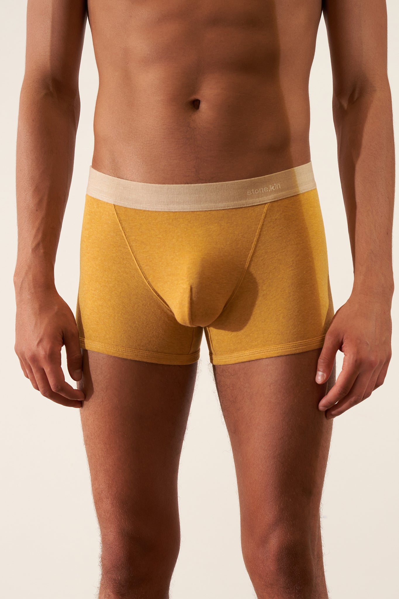 Boxer Brief in Organic Cotton Rib - Mustard / Sand on a male model, showcasing comfort and style.