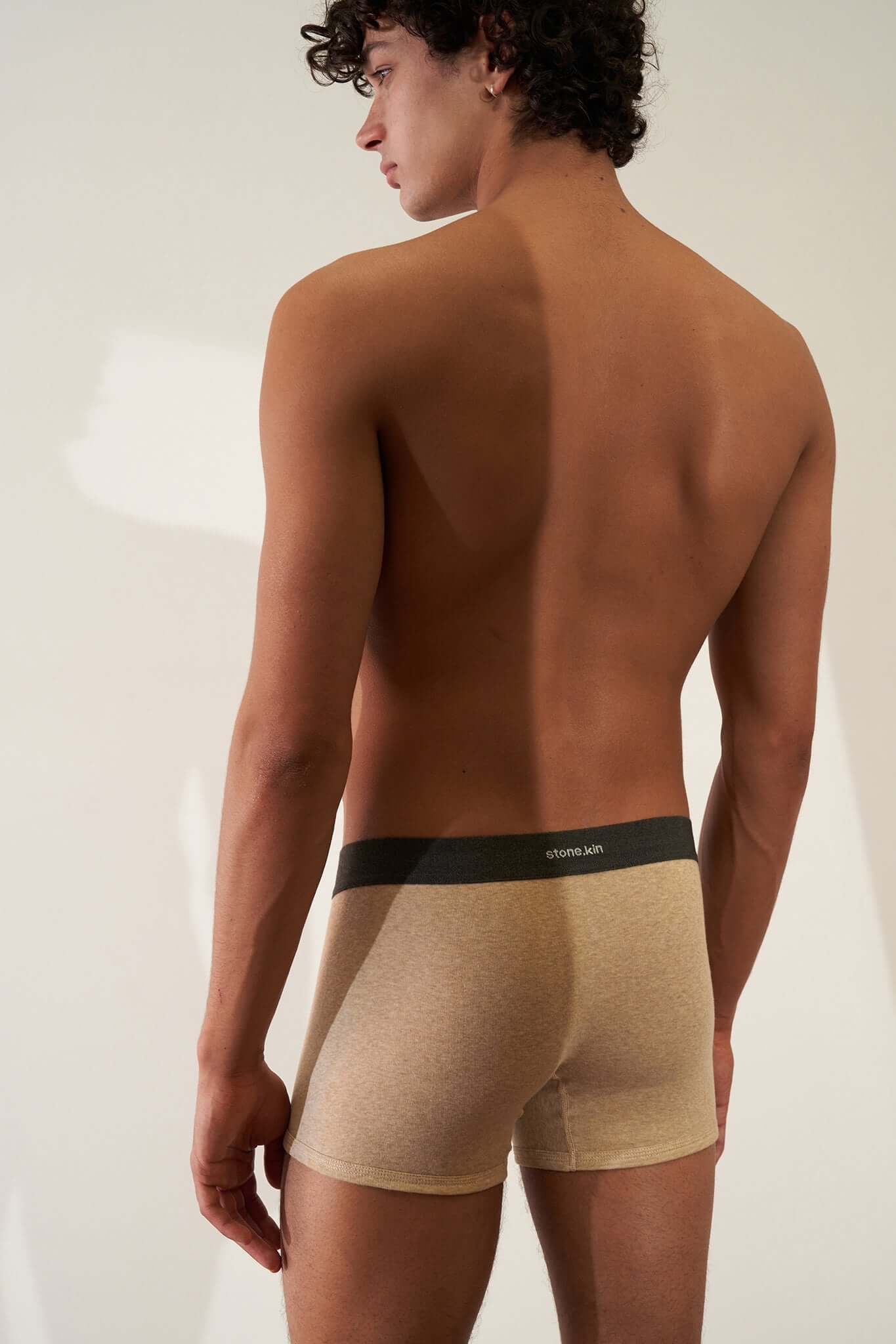 Boxer Briefs 3 Pack in Organic Cotton shown on model, featuring mustard and sand colors for comfort and style.