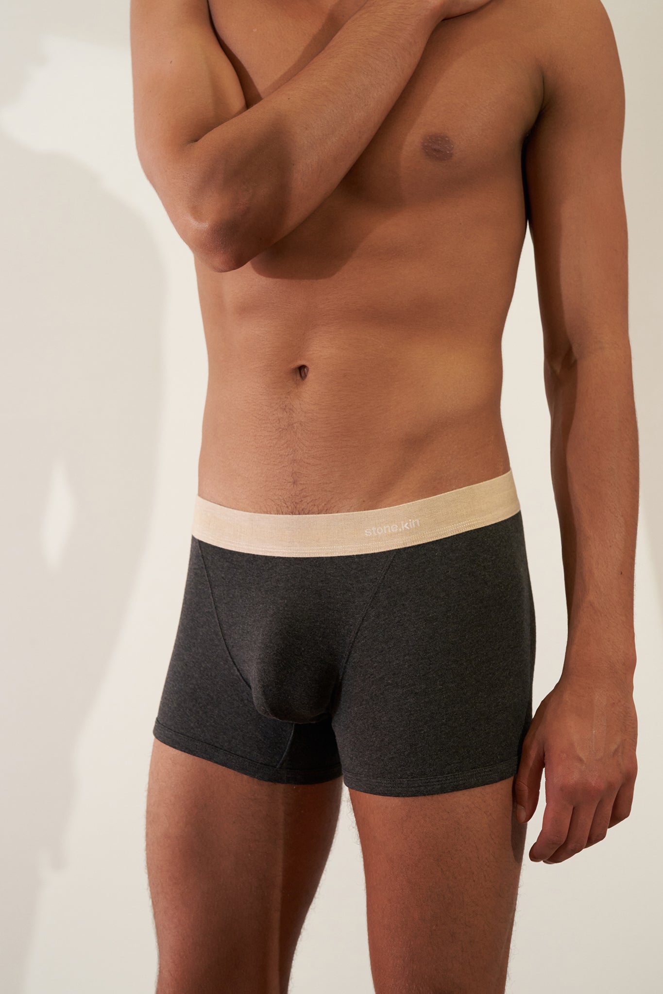Boxer Brief in Organic Cotton Rib - Tar / Sand worn by a model, showcasing softness and stretch.