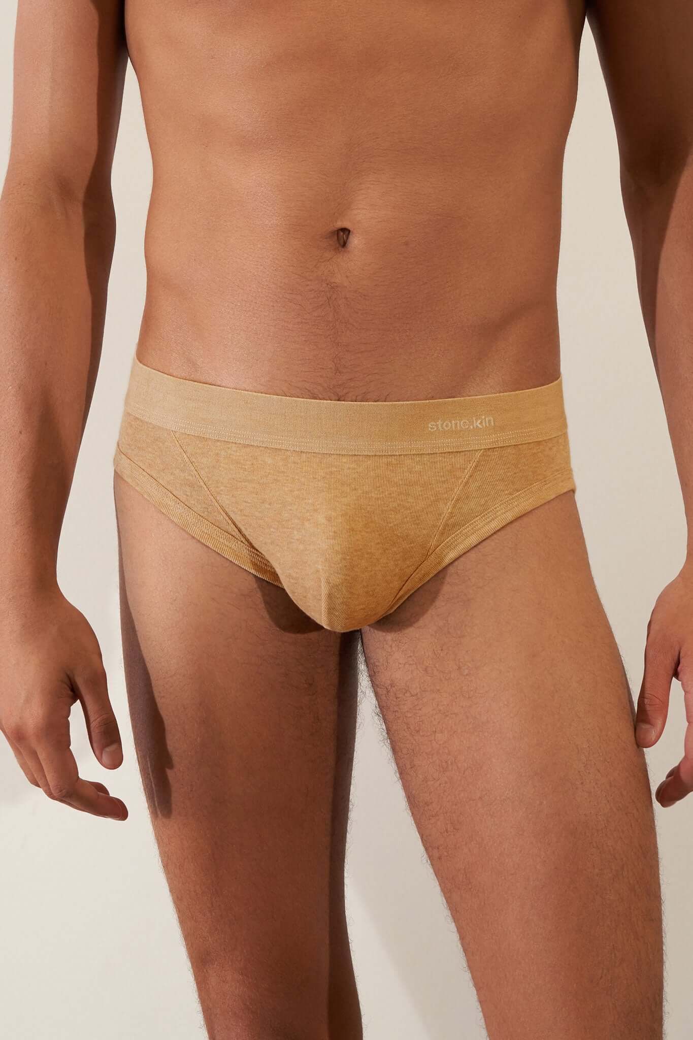 Men's Brief 3 Pack in Organic Cotton featuring a model wearing the camel-colored brief.