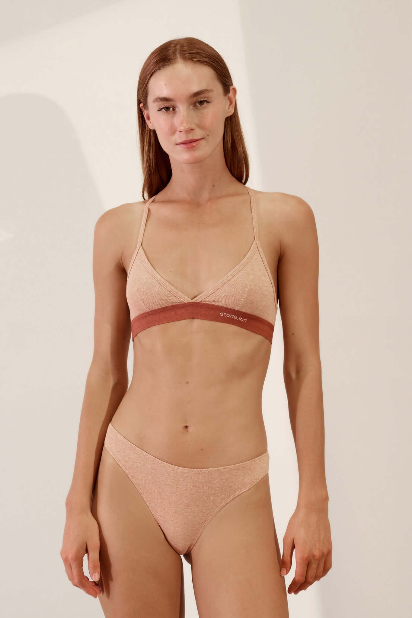Model wearing Hi Thong in Organic Cotton Rib - Nude and matching bralette, showcasing comfort and style.