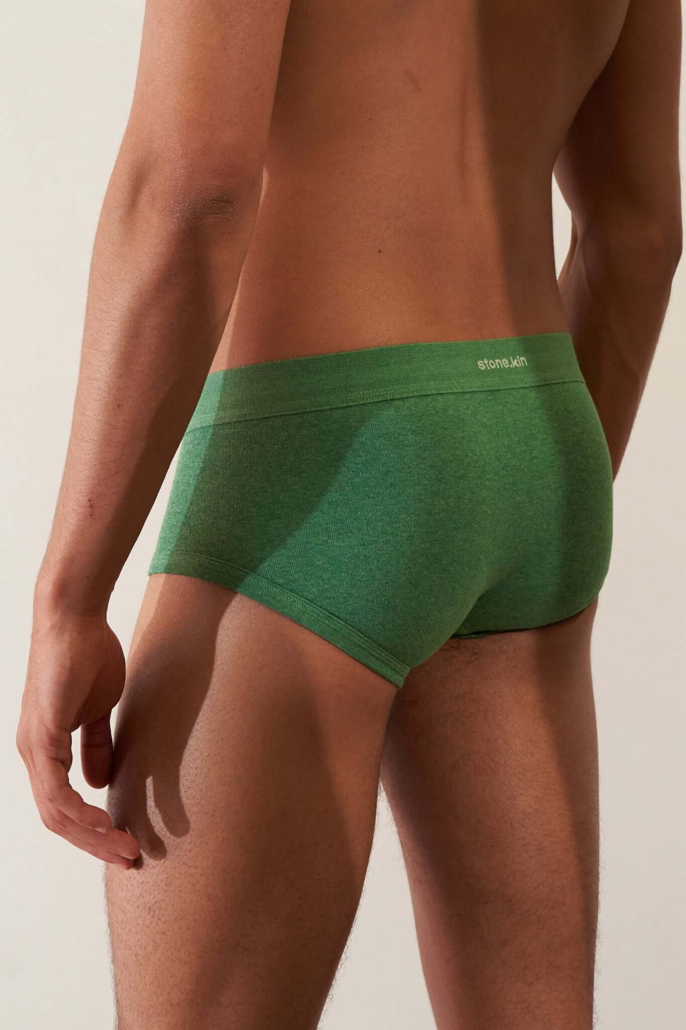 Trunk 3 Pack in Organic Cotton displayed on a model wearing green underwear, highlighting comfort and style.