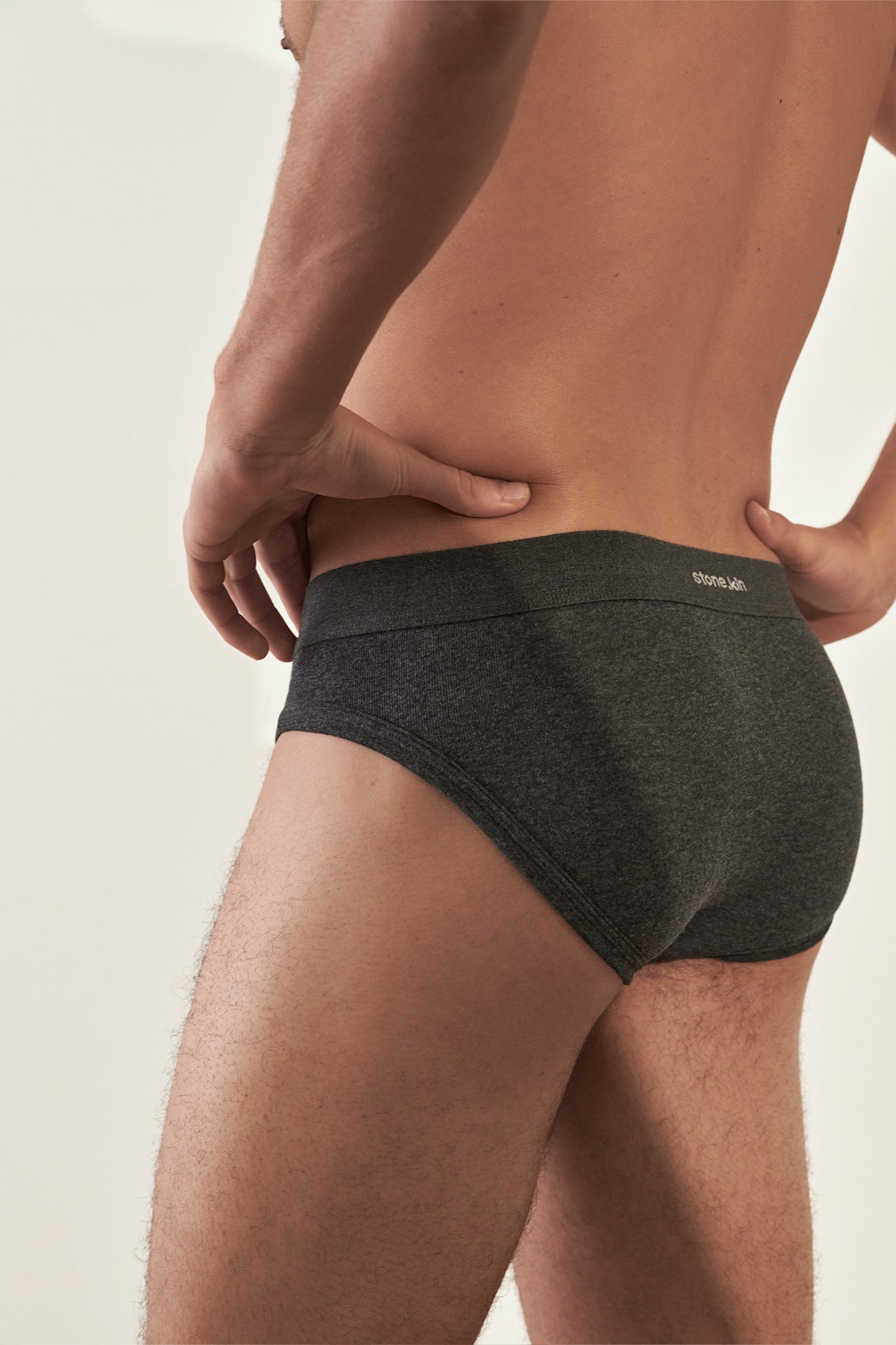 Stonekin Men's Organic Cotton Brief 3-Pack in Tar, Camel, and Lake colours, offering a sleek design and ultra-soft organic cotton for superior comfort.